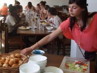 CR Dinner being served girl taking bread